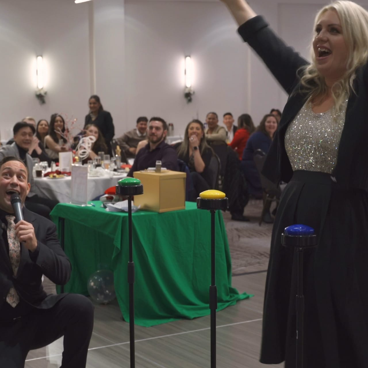 A guest cheering with her arms up during a live Viva Funcouver event