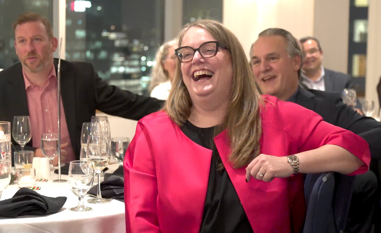 A guest laughing during a live Viva Funcouver game show